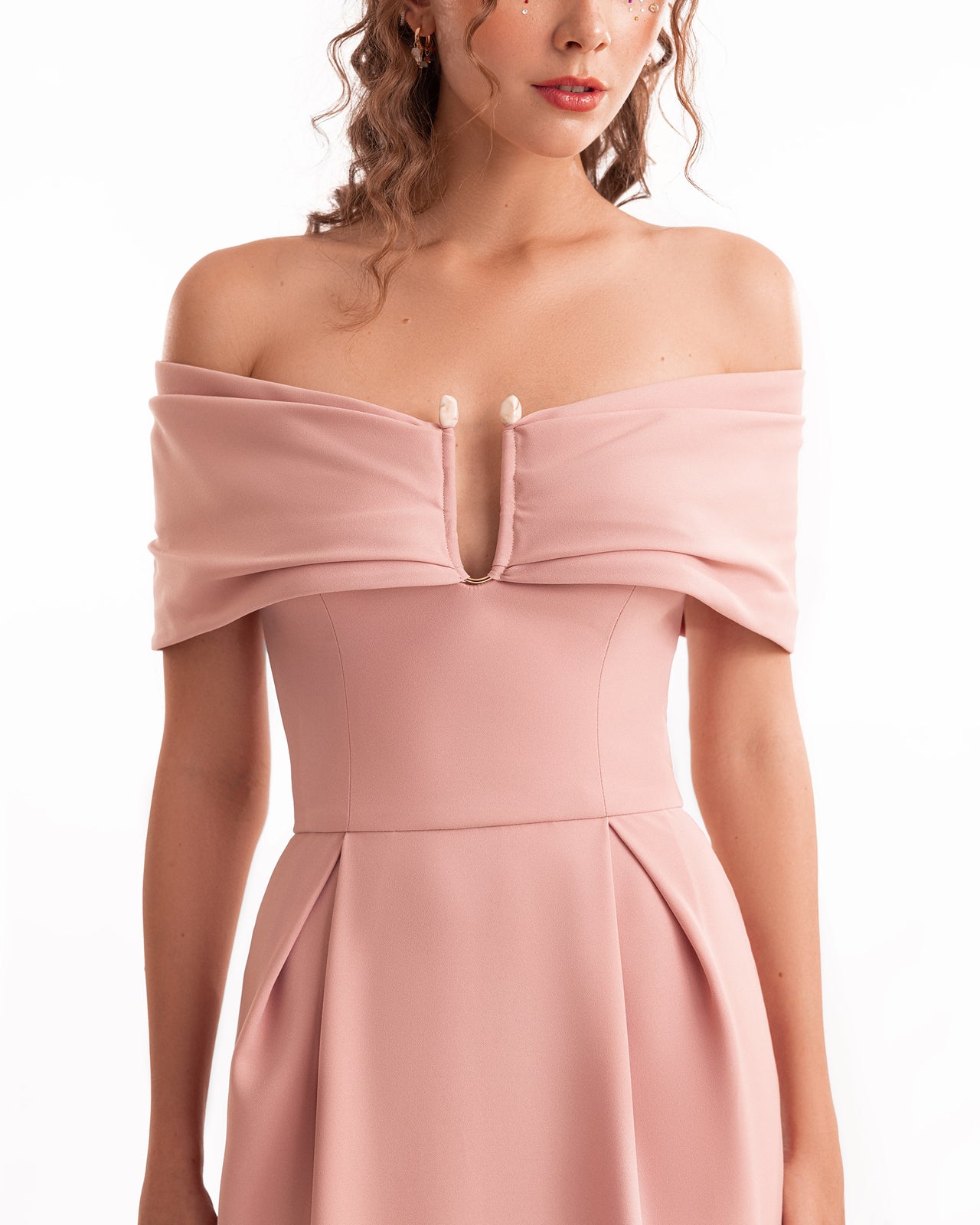 Pink off-shoulder dress on a white background