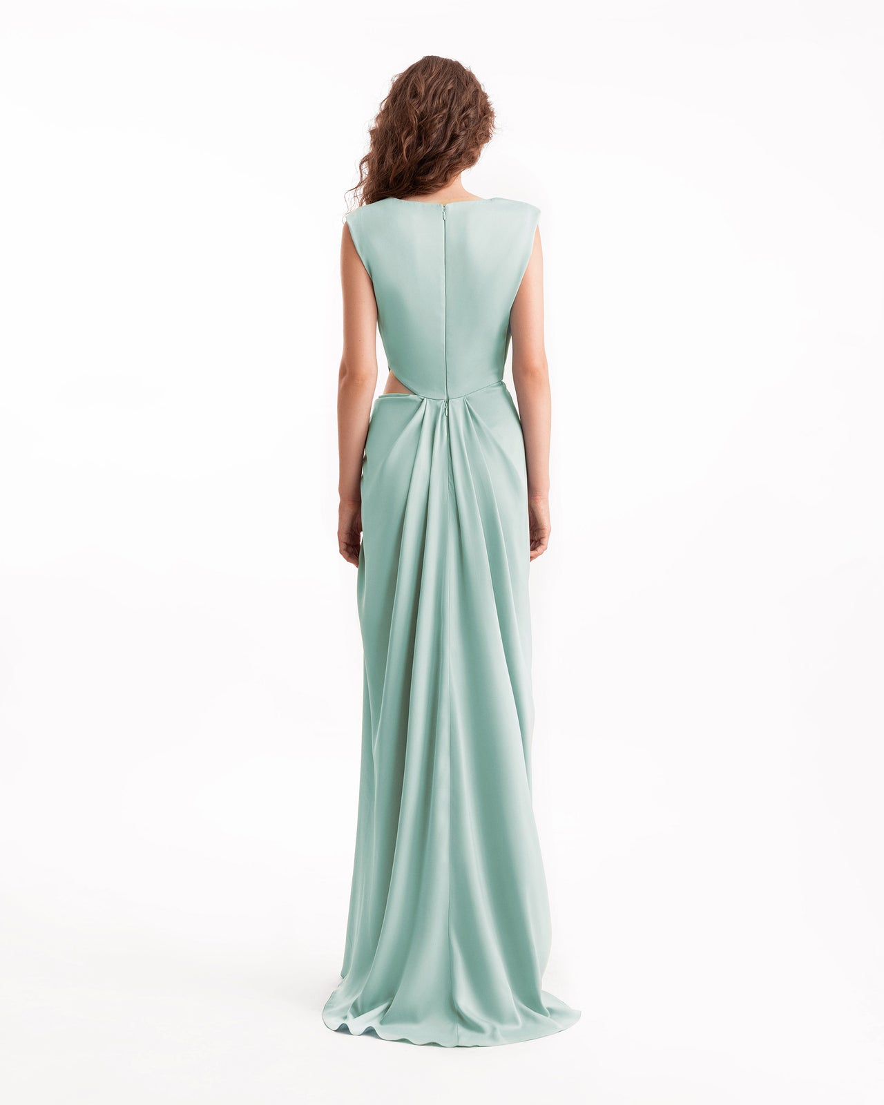 Woman wearing a light blue evening gown on a white background