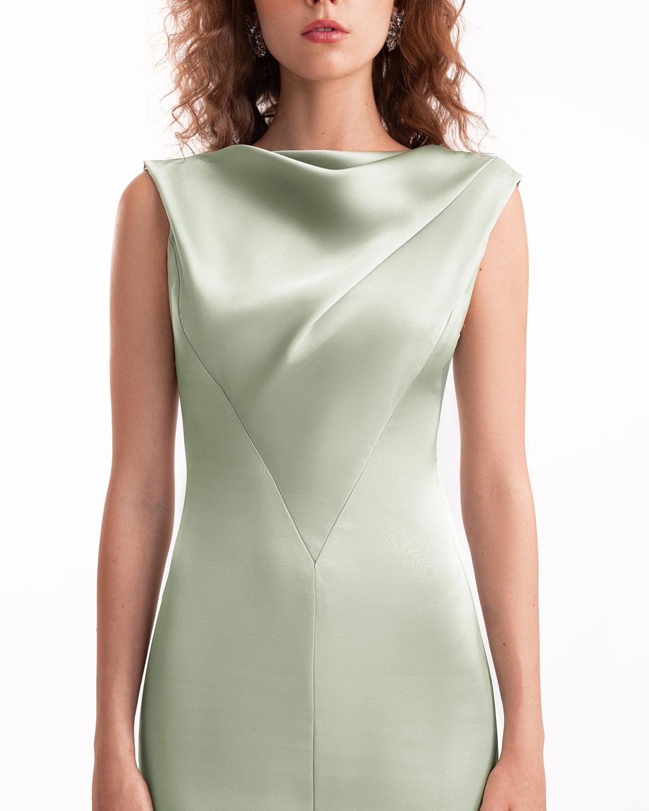 Light green dress worn by a model on a white background