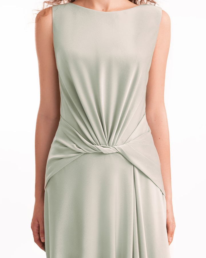 Sage green dress with a knot detail on a white background