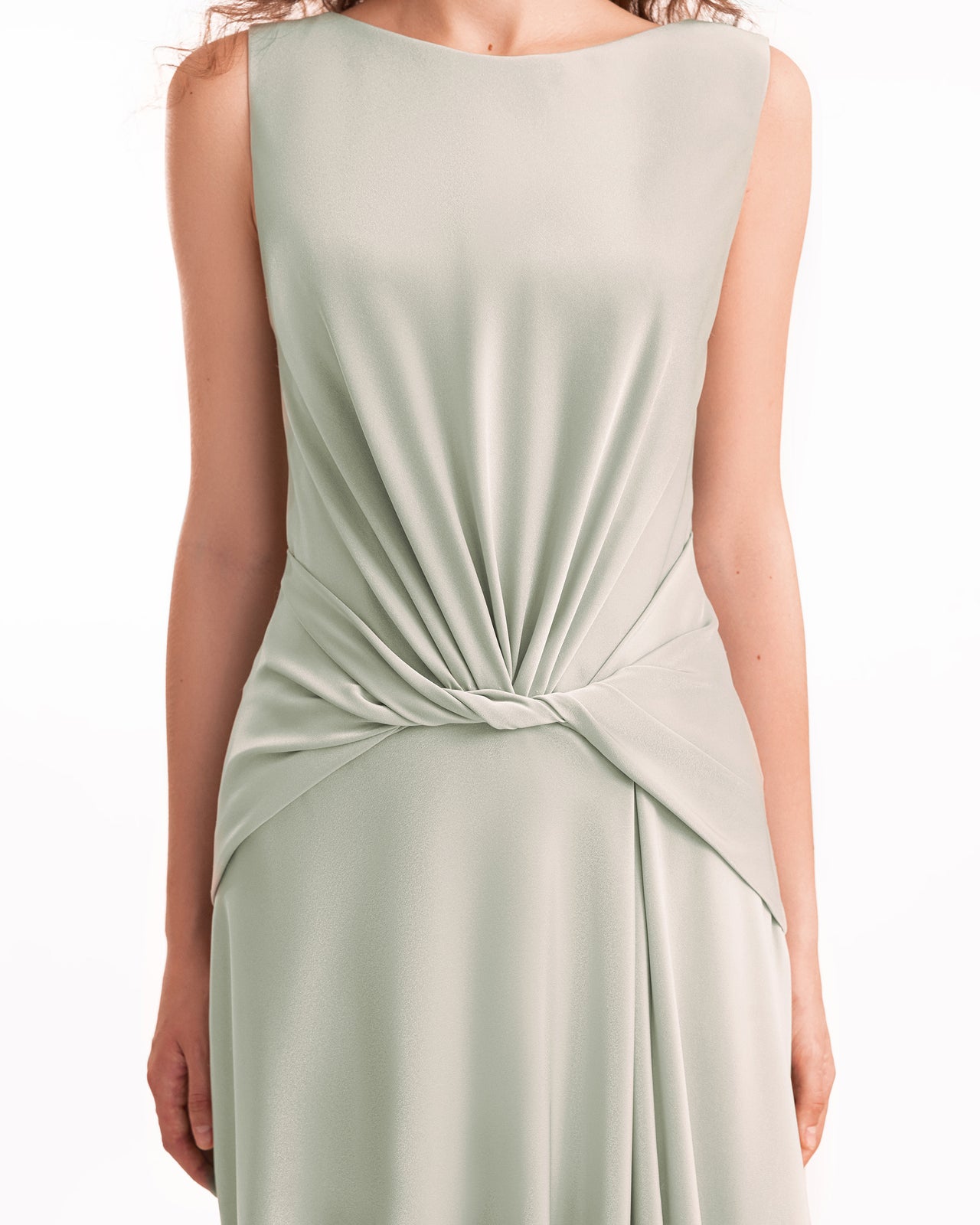 Sage green dress with a knot detail on a white background
