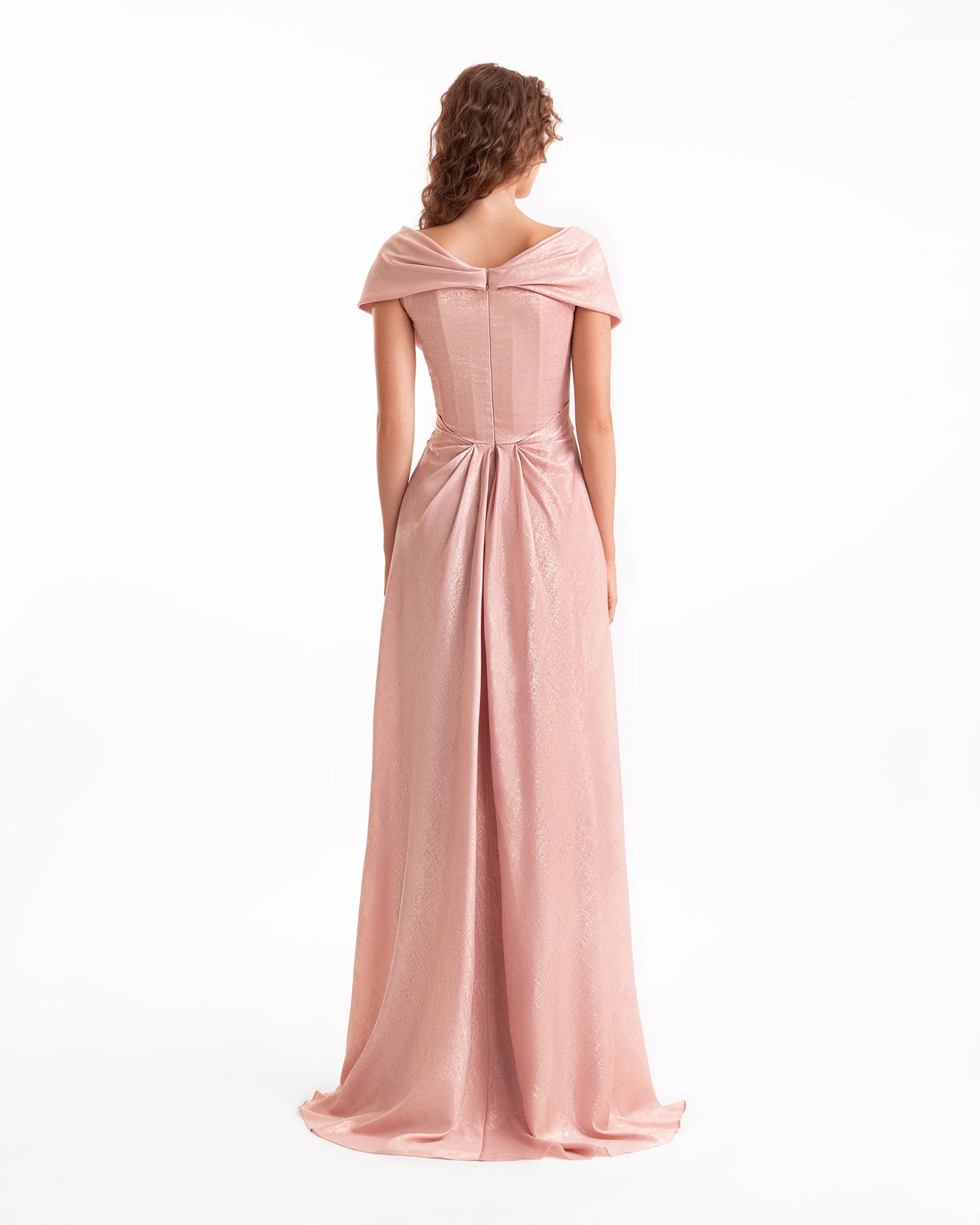 Pink evening gown with a bow detail on a white background