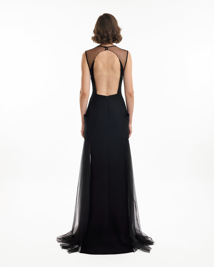 Black evening gown with sheer back on a white background