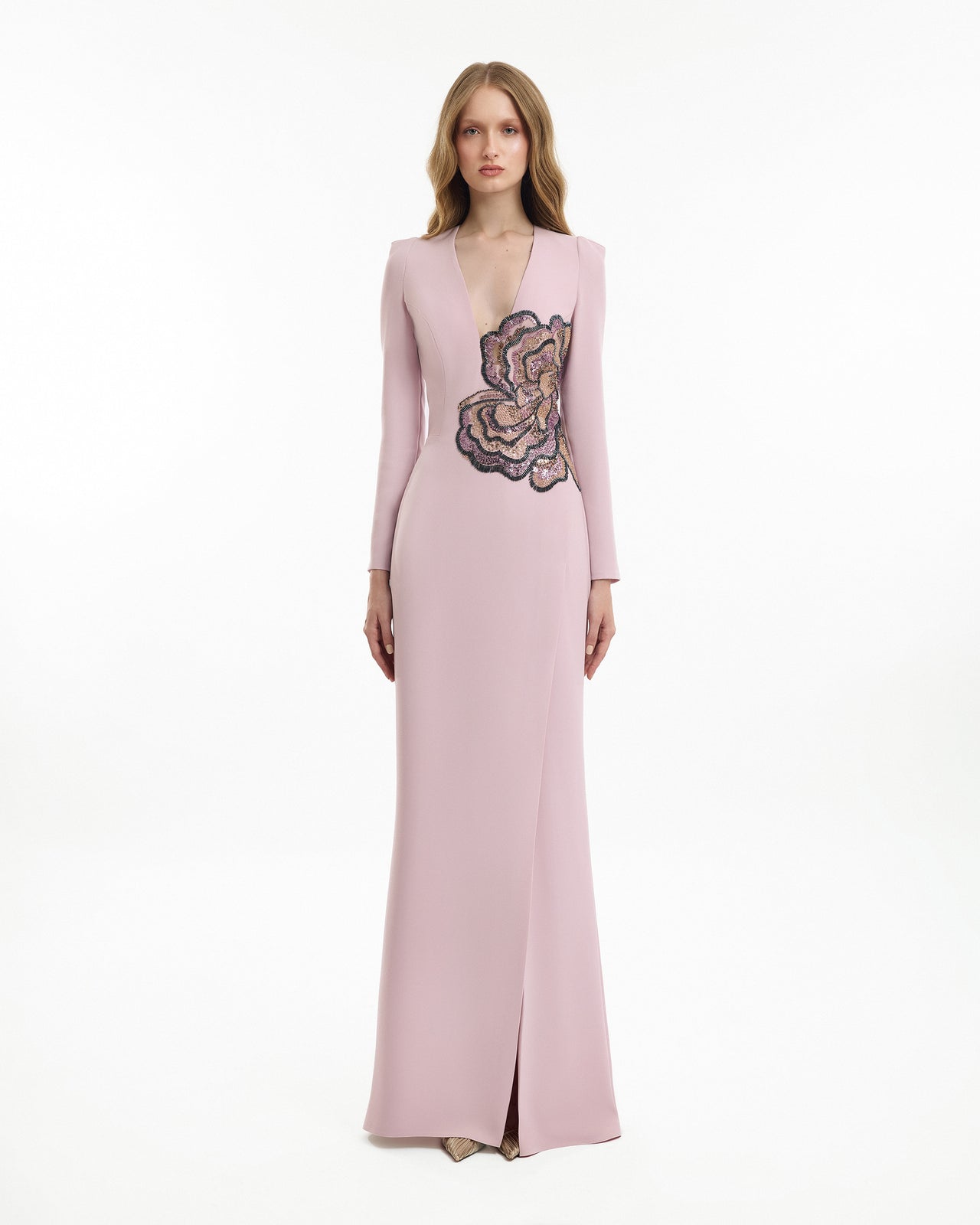 Pink evening gown with floral embroidery on a white background