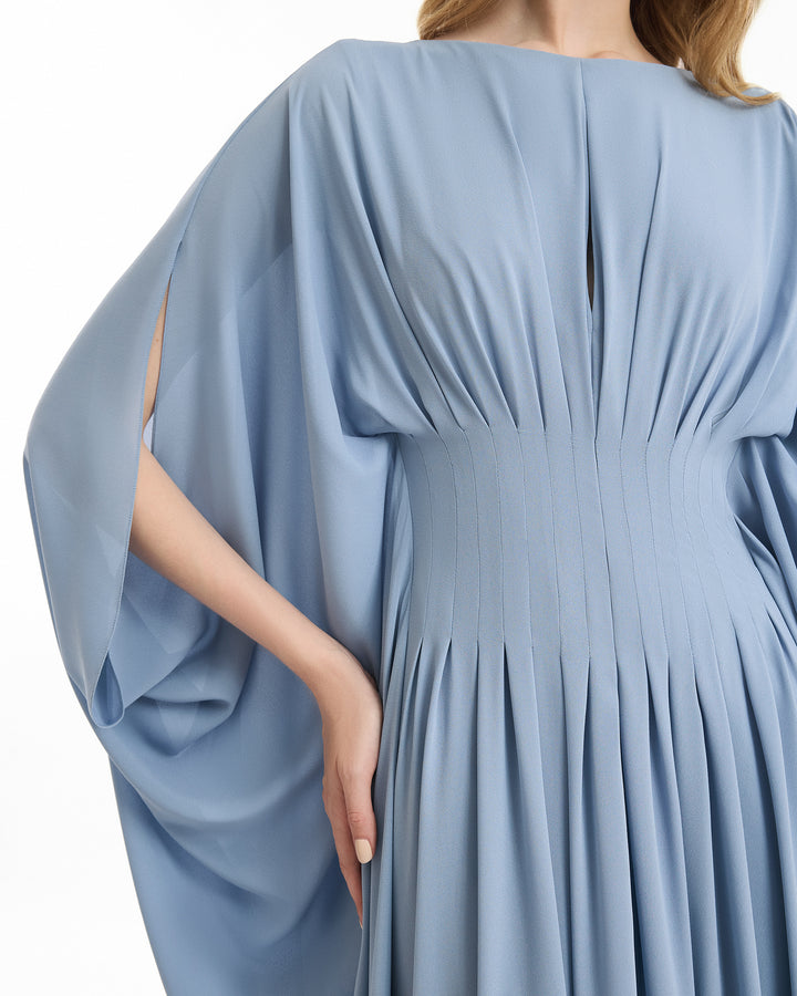 Light blue dress with wide sleeves on a white background