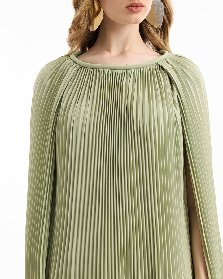 Green pleated dress with a plain background