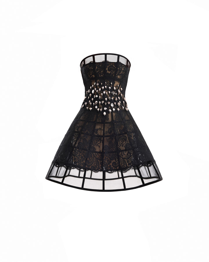A black lace corset-style mini dress with sheer mesh panels and a decorative band of rhinestones around the waist, shown against a plain white background.