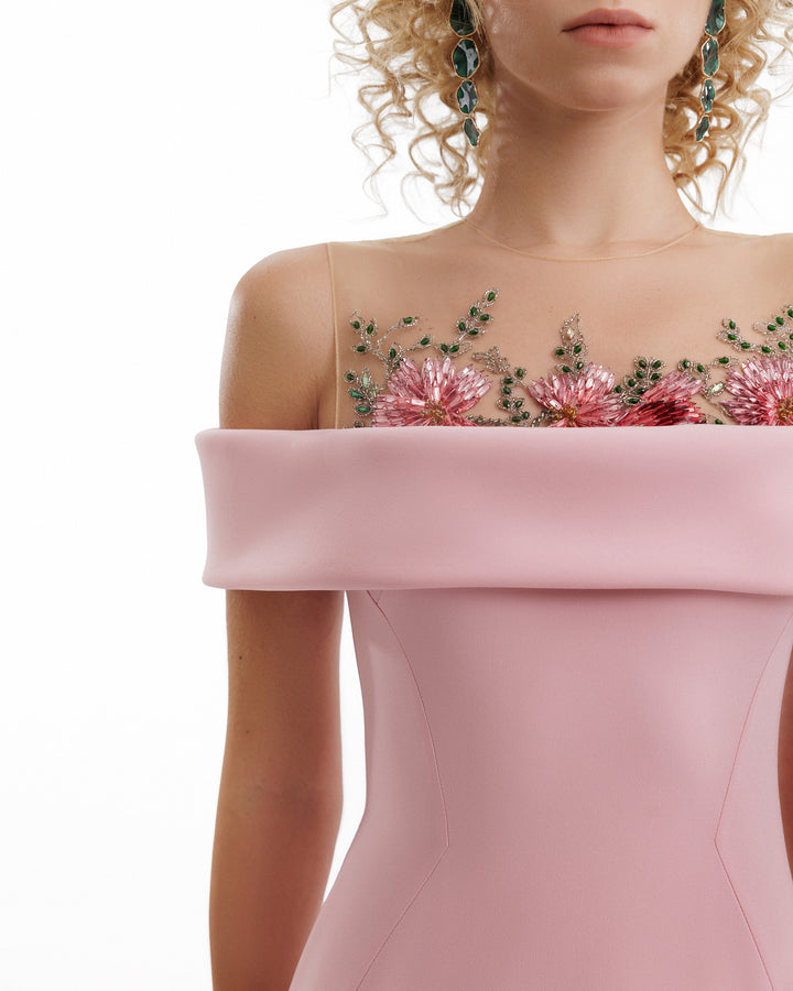 Pink off-shoulder dress with floral embroidery on a white background