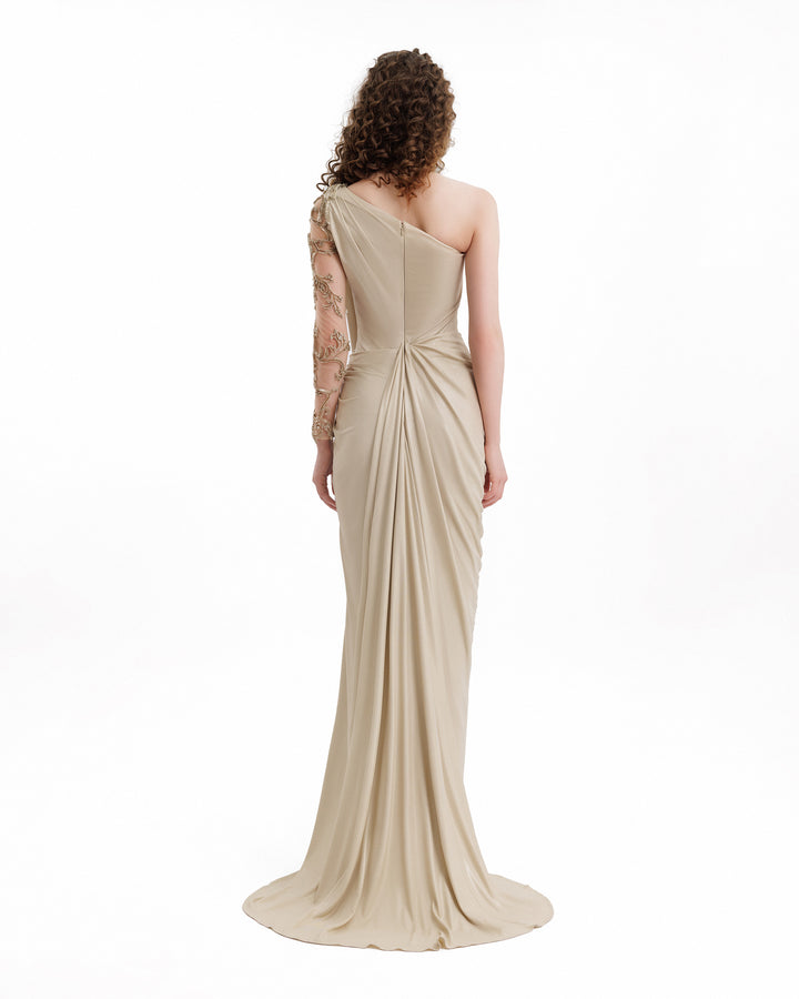 Beige evening gown with a draped design on a white background