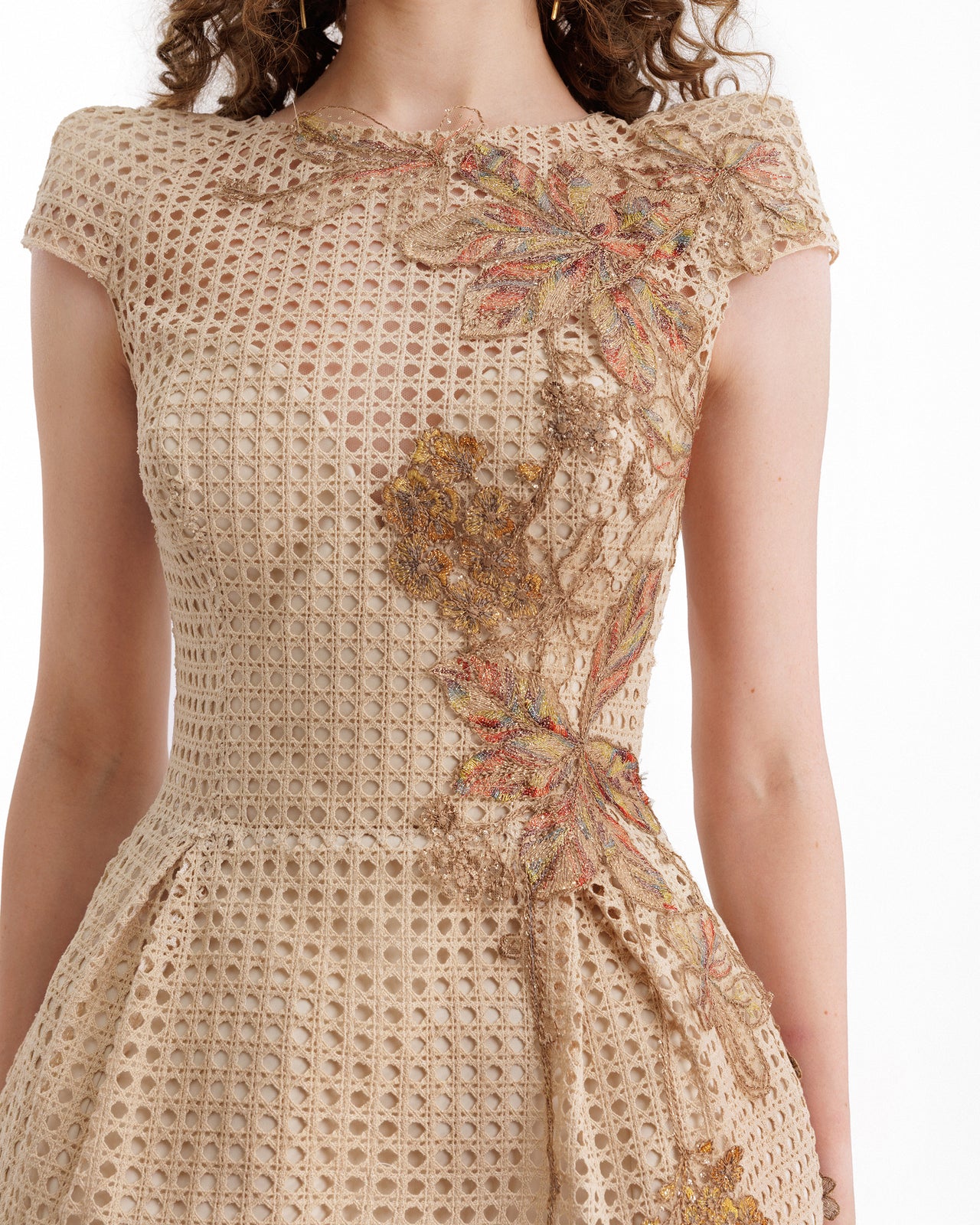 Beige dress with floral patterns on a white background