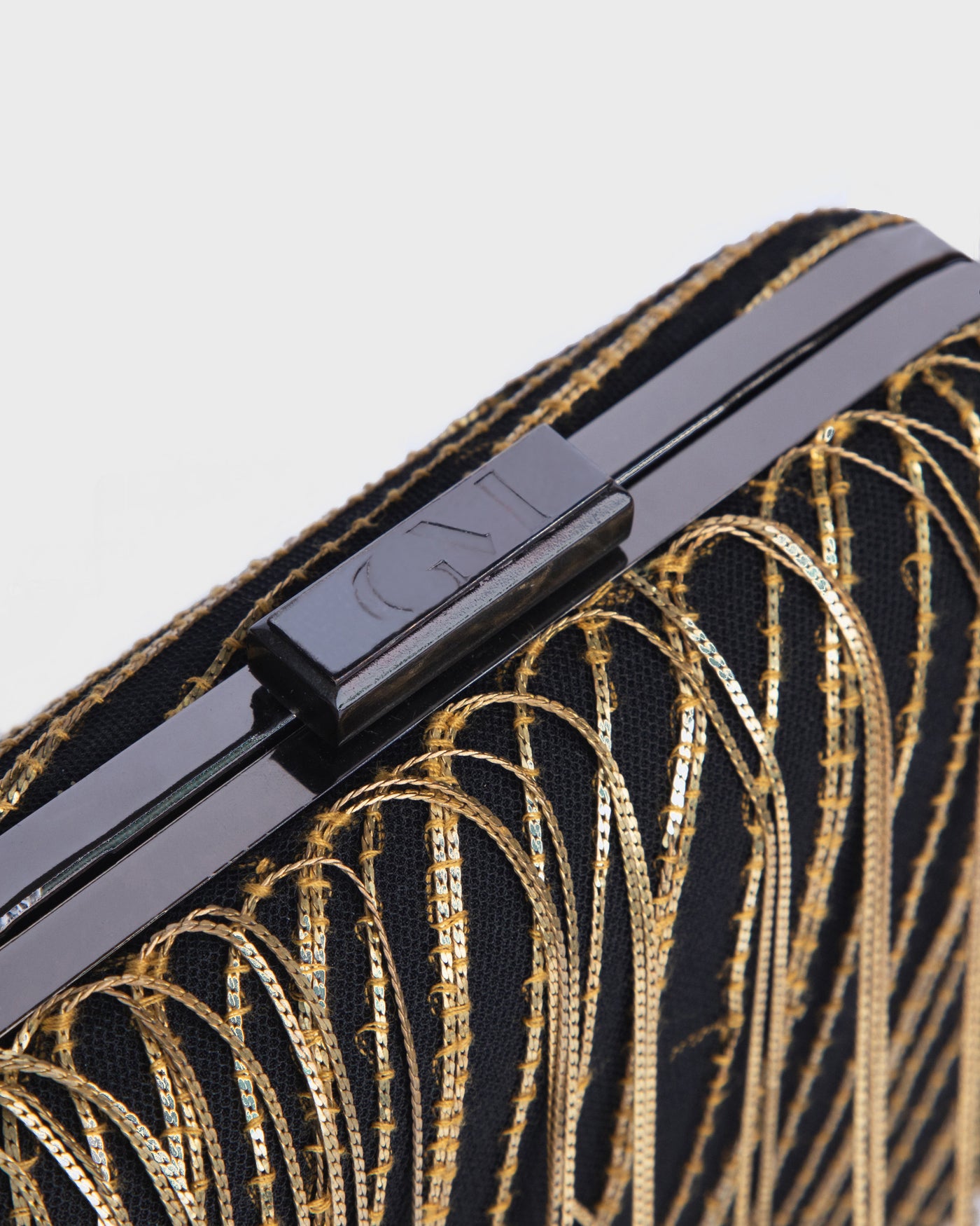 Clutch With Metallic Fringes