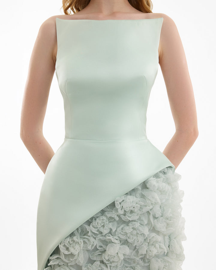 Light green strapless dress with lace overlay on a white background