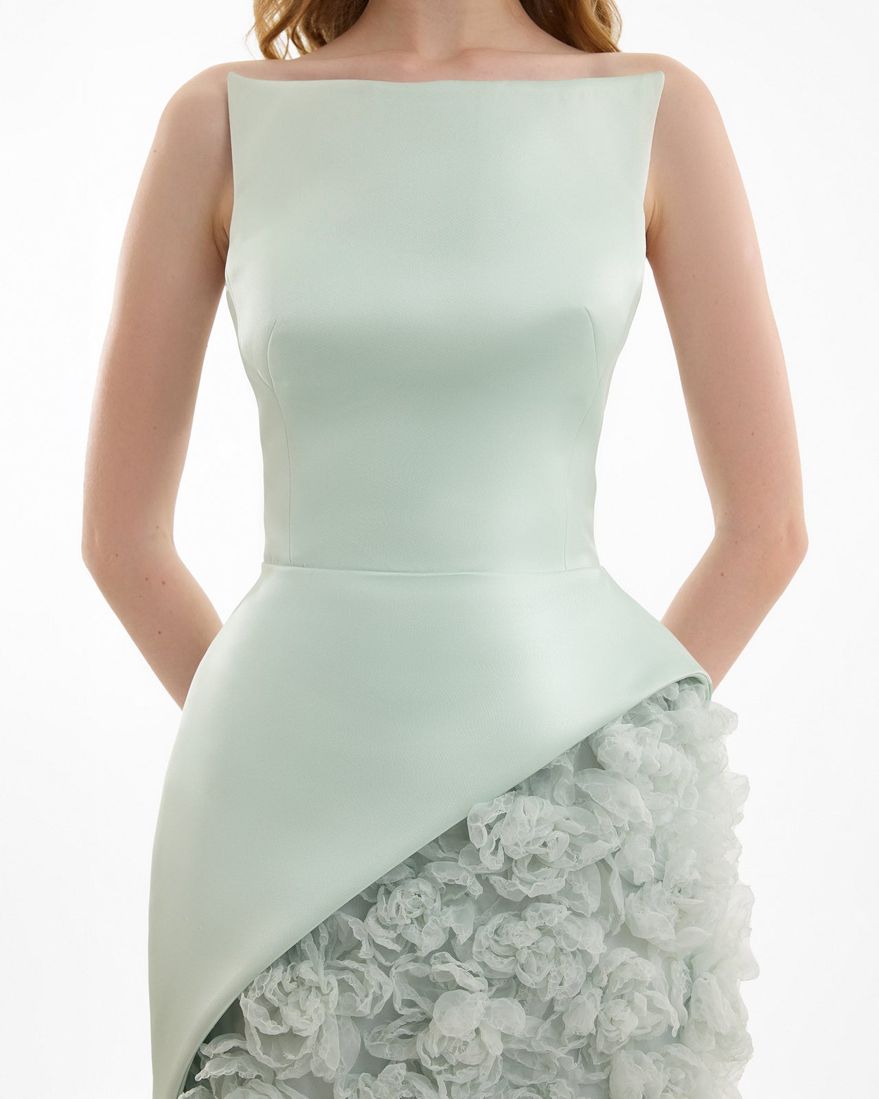 Light green strapless dress with lace overlay on a white background