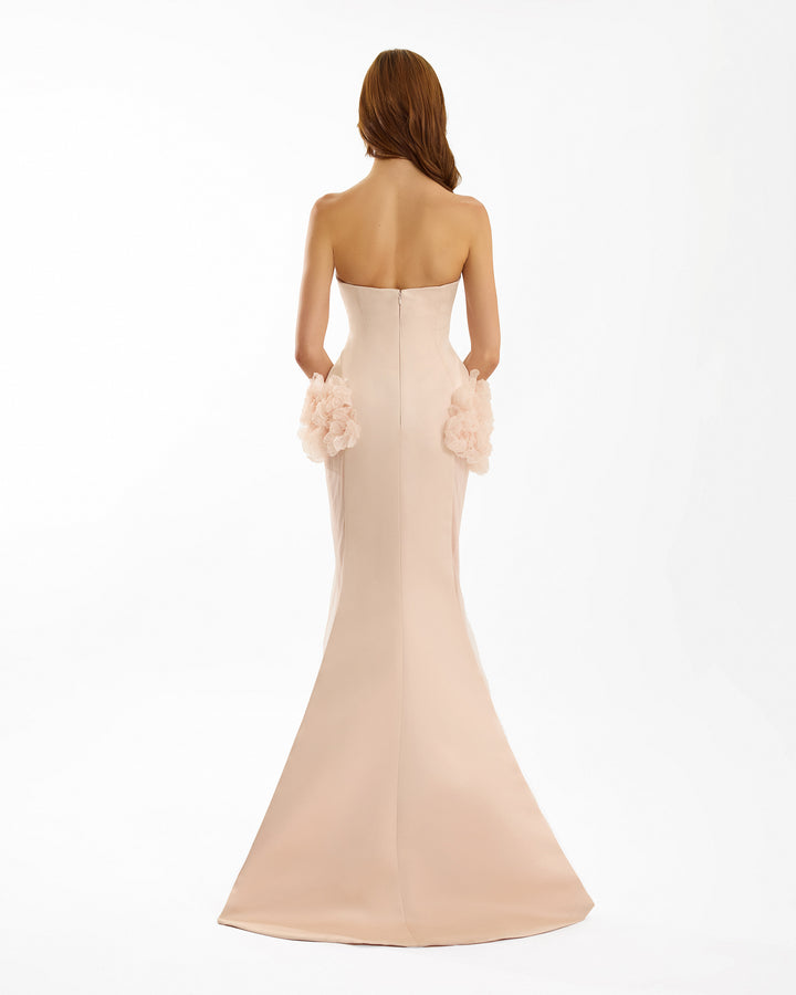 Beige strapless gown with floral details on a white background
