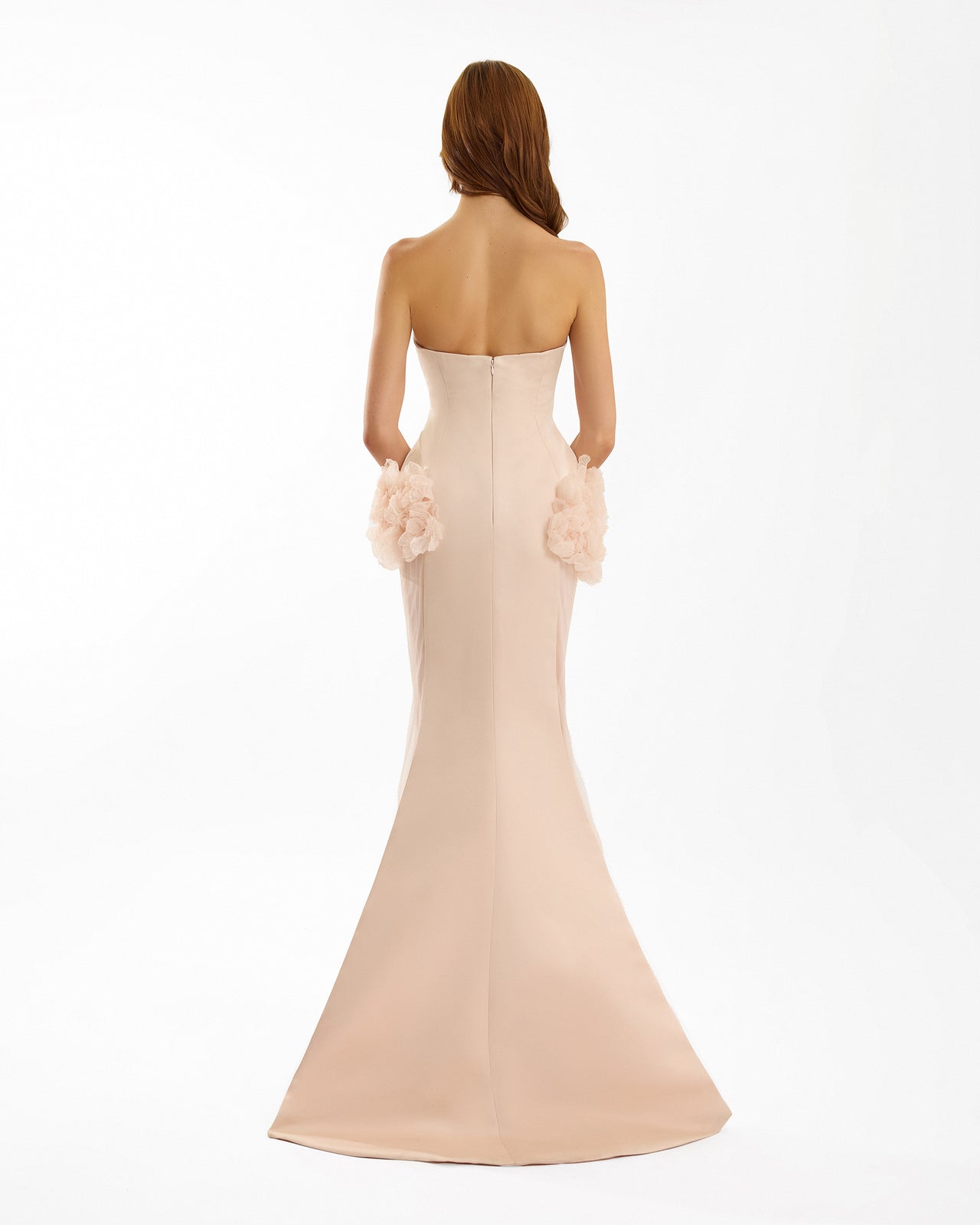 Beige strapless gown with floral details on a white background