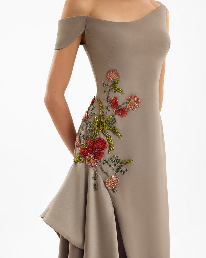 Beige off-shoulder dress with floral embroidery on a white background
