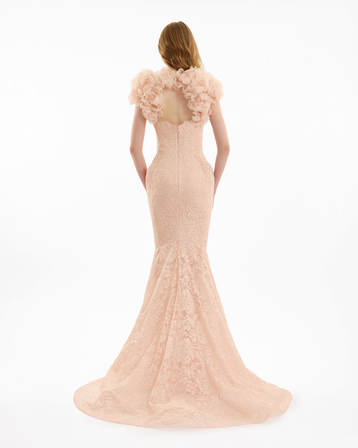 Blush pink evening gown with floral details on a white background