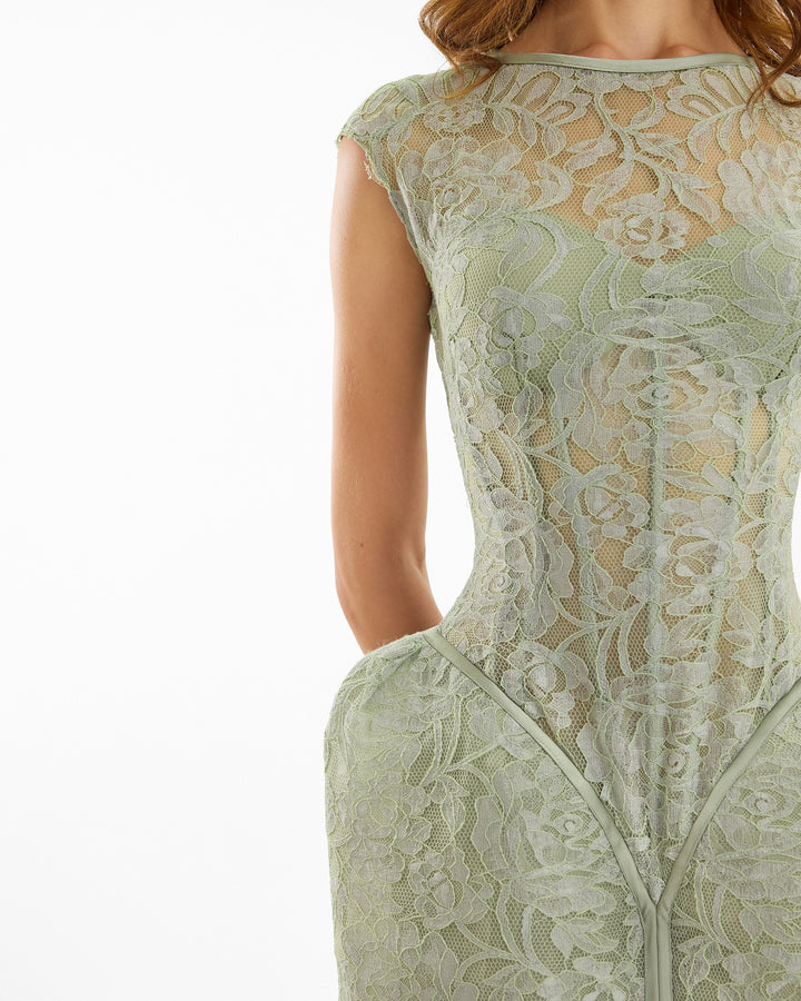 Green lace dress on a white background