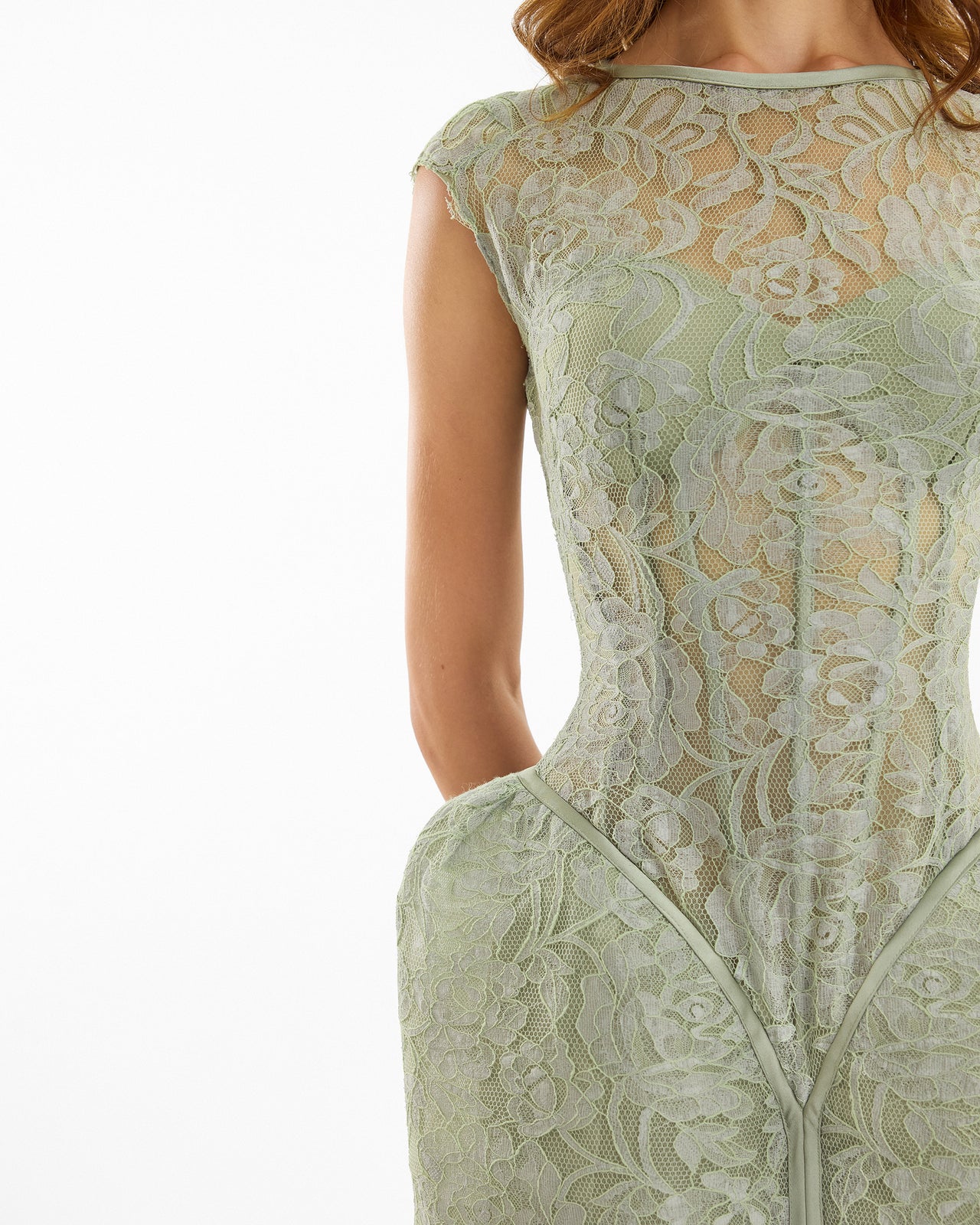 Green lace dress on a white background