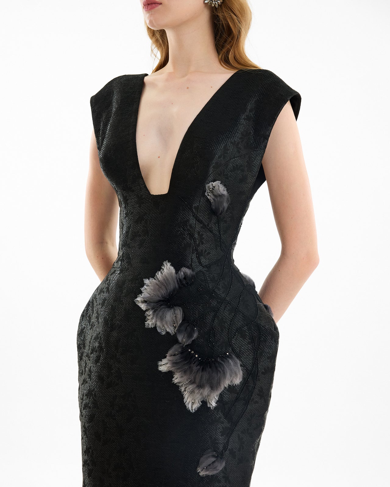 Black dress with floral details on a white background