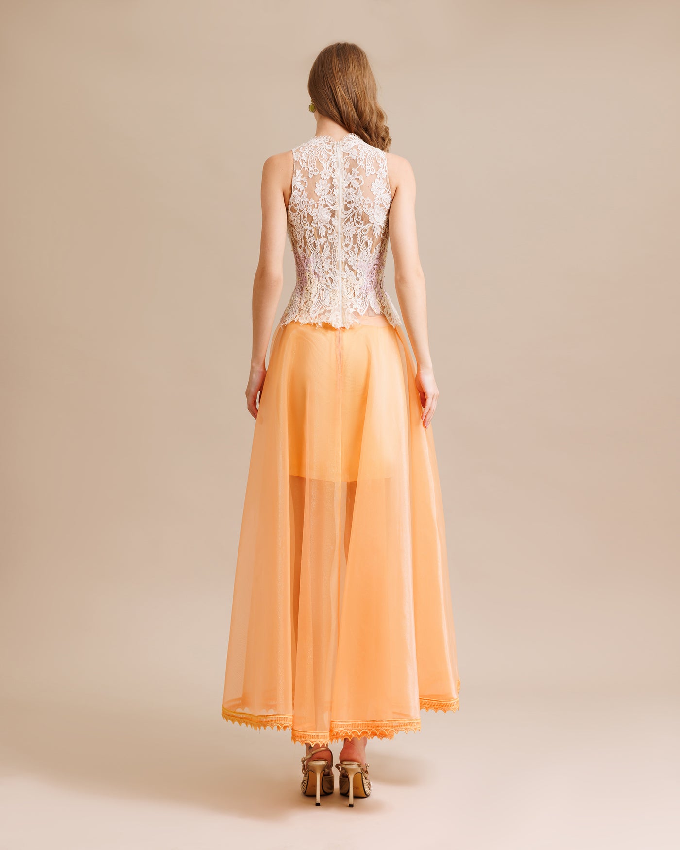 A Voluminous Skirt With A Halterneck Lace Top