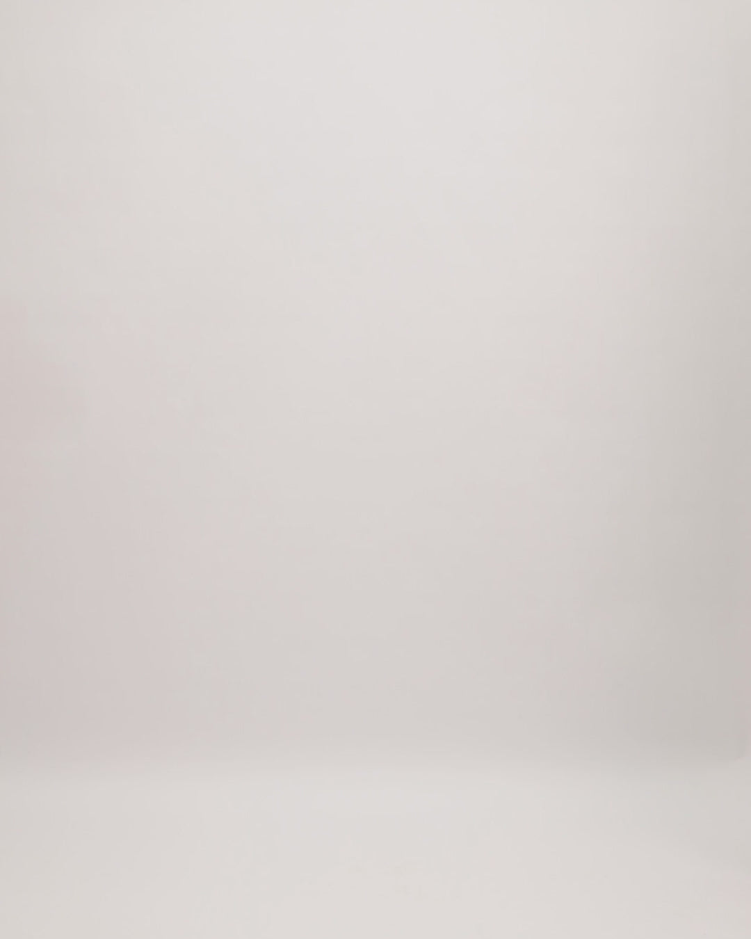 A fully beaded v-neckline golden dress with three-quarter sleeves and a slit at the back.