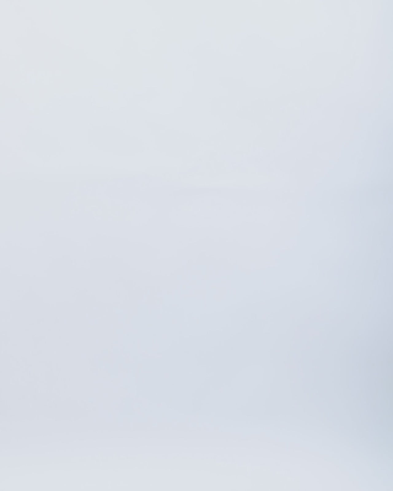 A slim-cut evening dress featuring draping on the waistline and floor-length sleeves in blue patterned sequins fabric.