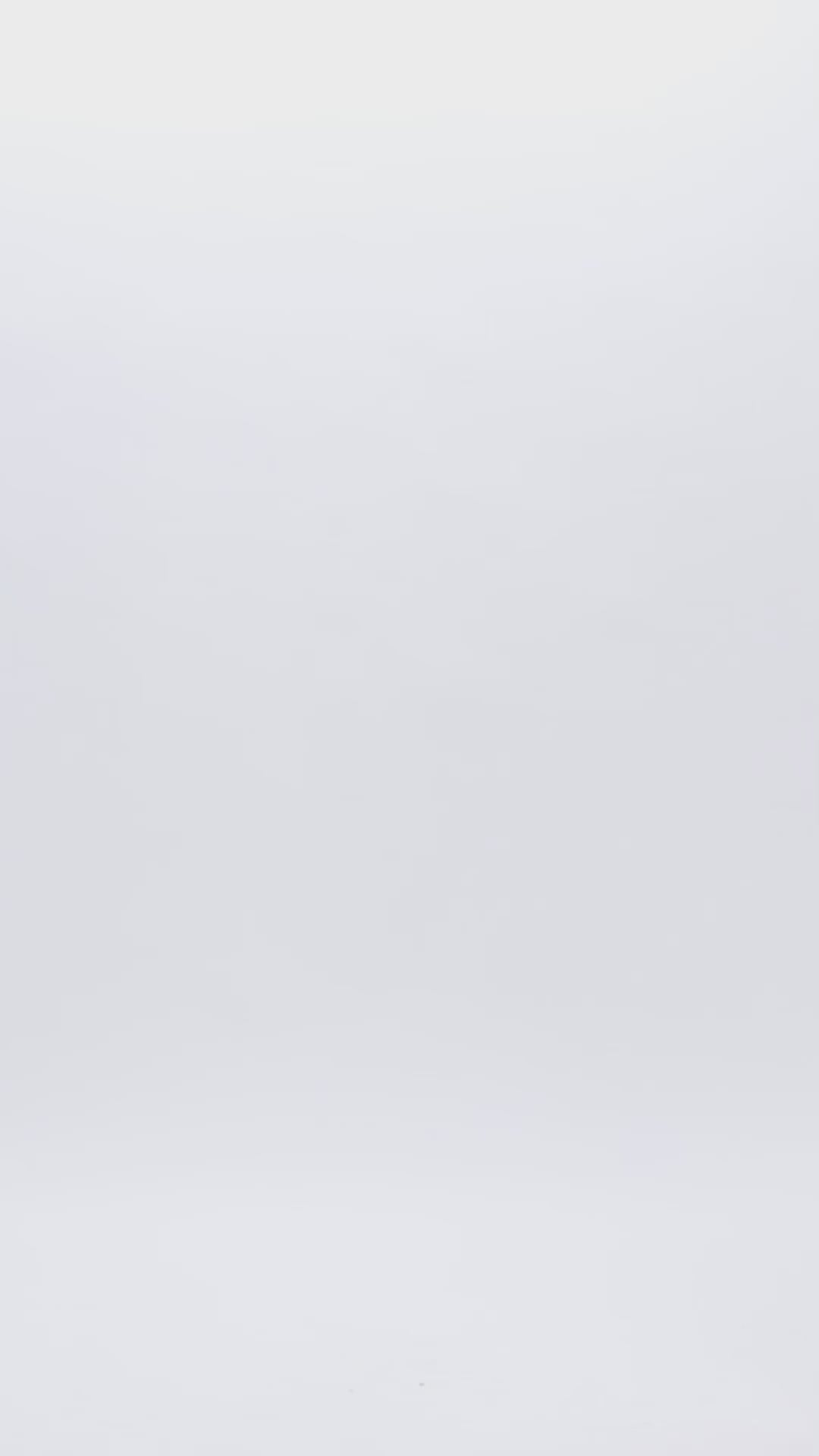 An evening wear pink set featuring organza high-collar top with open shoulders and a long back, paired with wide high-waist pants.