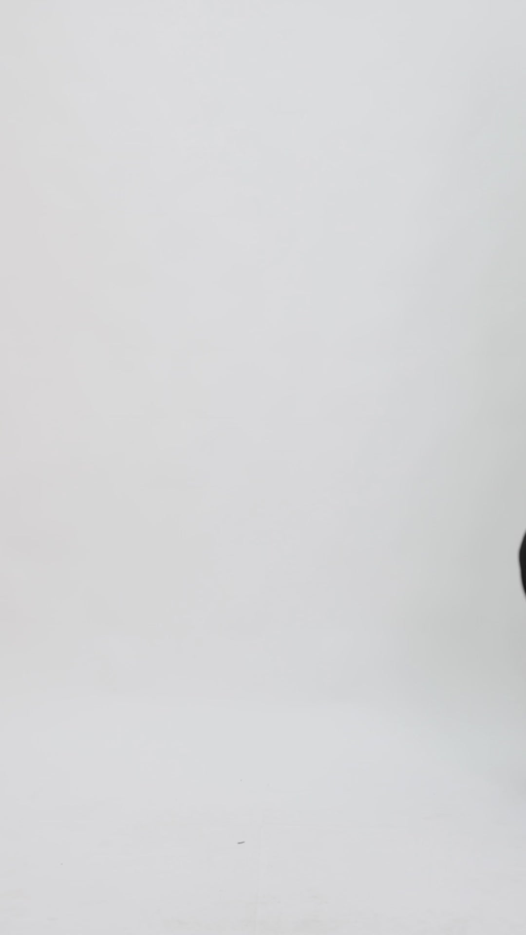 A black evening wear set featuring a long-sleeve patterned lace top paired with a long slim-cut skirt.