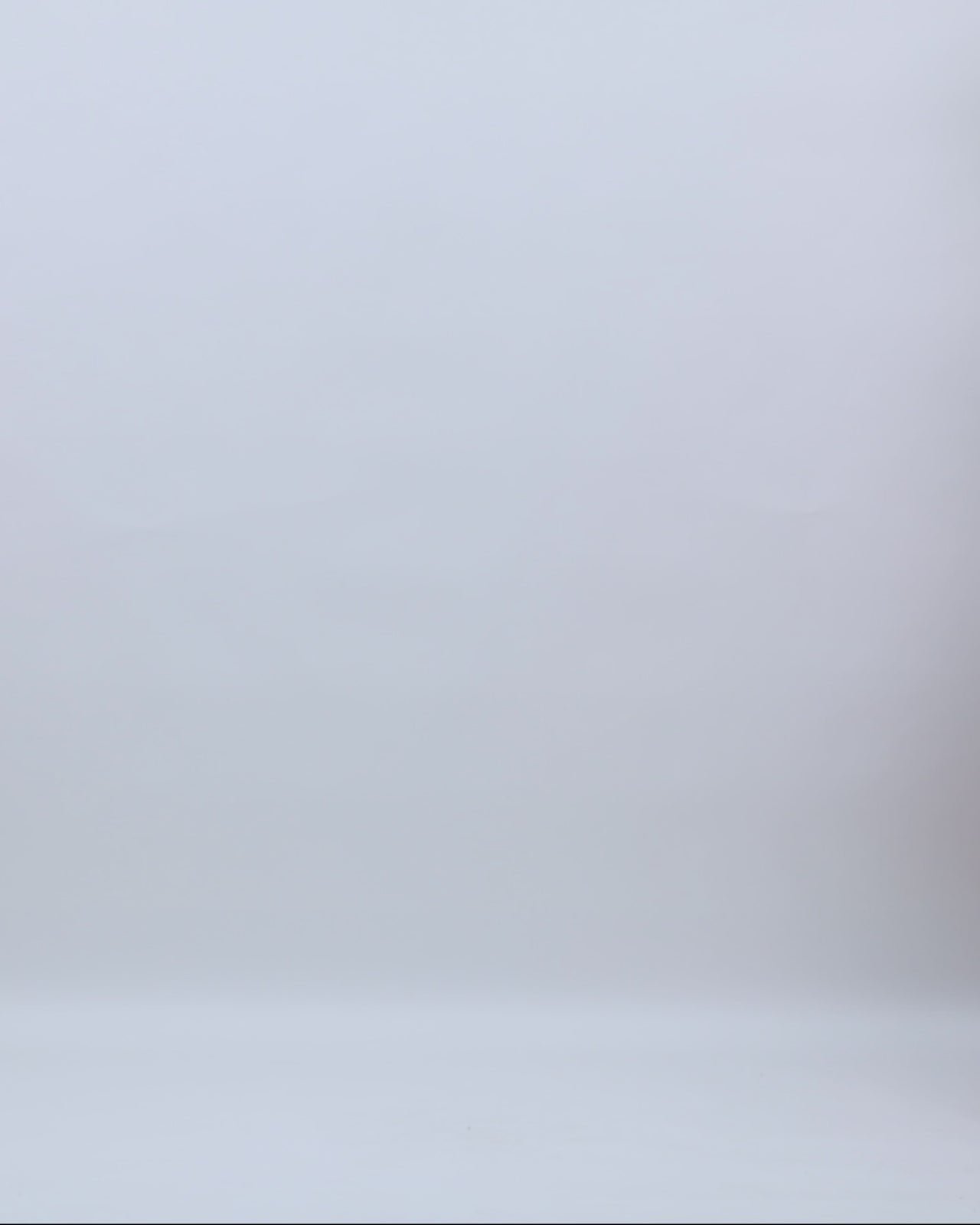 A cap sleeves evening gown in copper color with see-through waist details and a wide skirt.