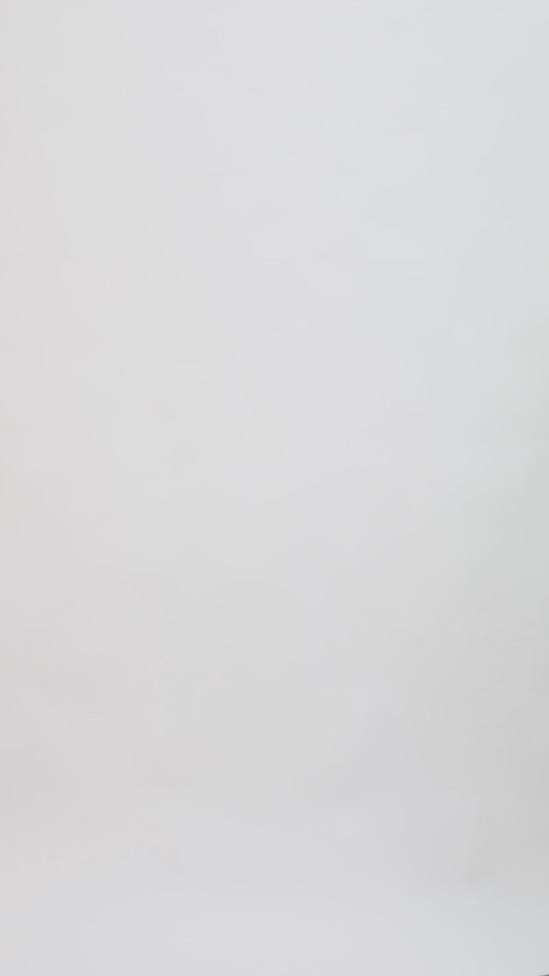 A black evening wear set featuring a long-sleeve patterned lace top paired with straight-cut pants with slits on the sides.