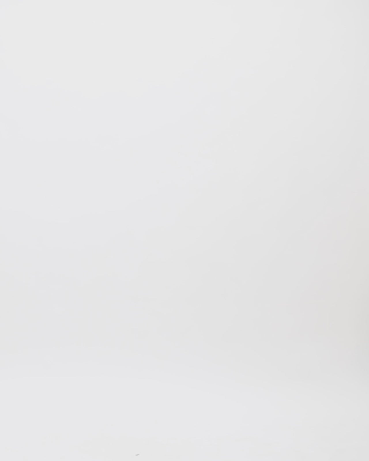 A loose-cut kaftan style copper evening dress with beadings at the neckline and a draped back.