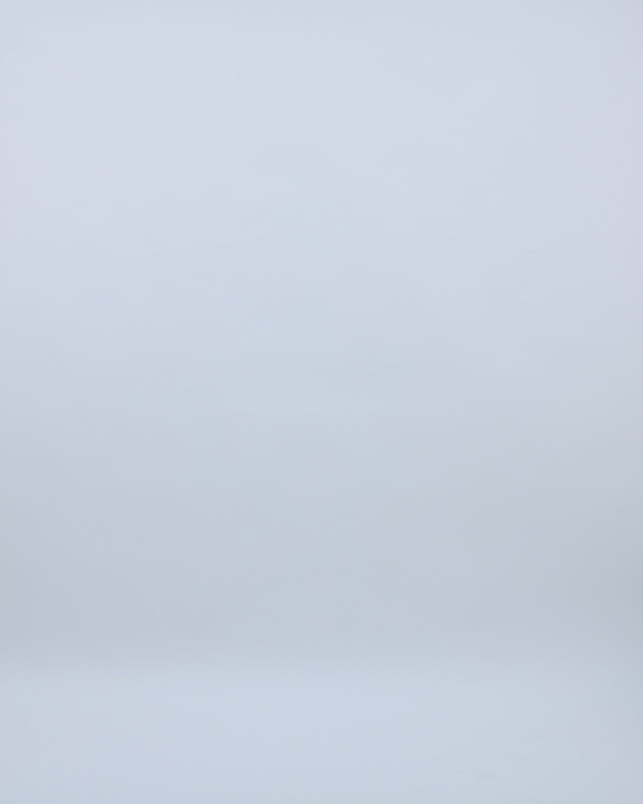 A sequins tasseled ivory short dress featuring a chiffon irisé draped long cape with a slit at the back.