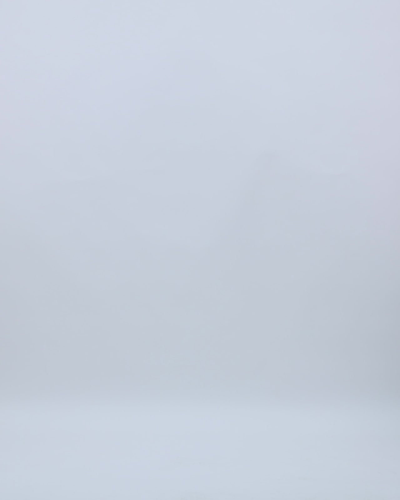 A draped cowl-neckline evening dress  in grey metallic jersey, featuring beadings on the shoulders and a draped waist.