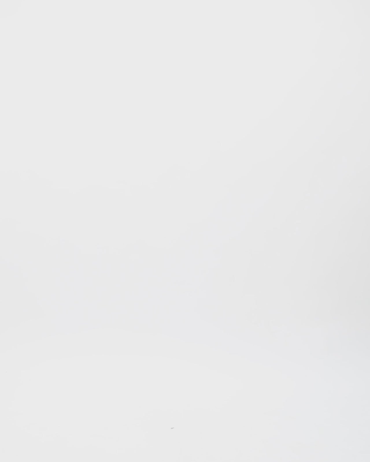 A kaftan-style evening dress in olive green color with a beaded collar and ruffled floor-length sleeves.