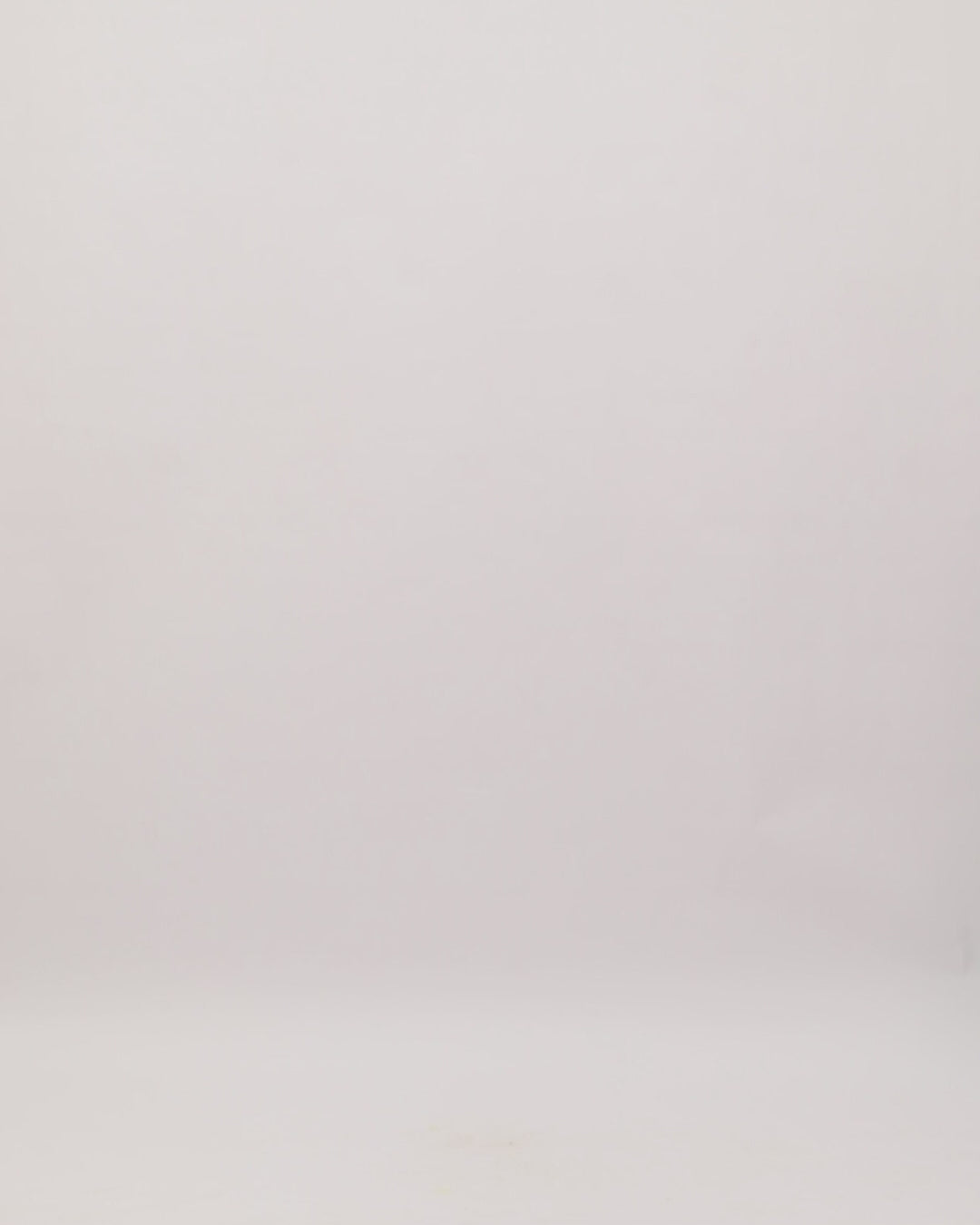 A V-neckline fully beaded evening dress with cape-like sleeves and a slit at the front.