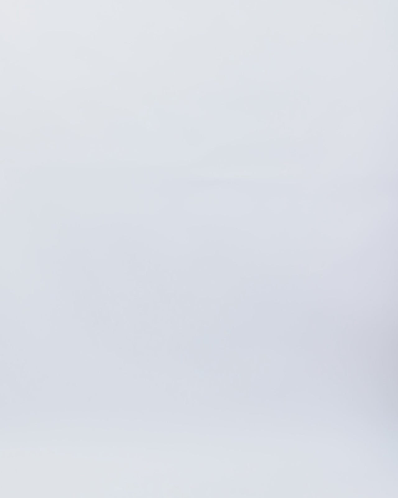 An evening wear orange set featuring a long sleeve top with a beaded neckline and beaded bow open back, paired with a slim-cut long skirt.