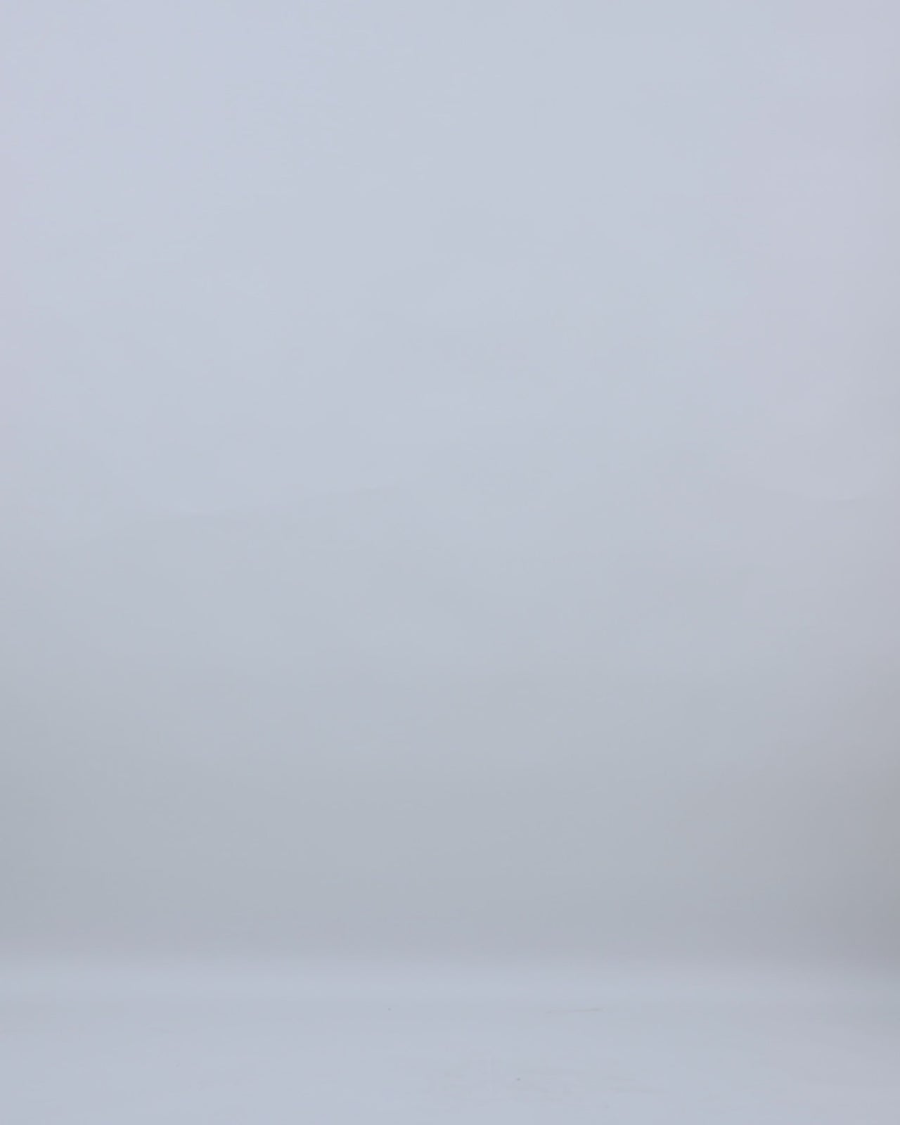 A slim-cut evening dress in light pink pleated organza Jacquard featuring a reversed collar and a long cape.