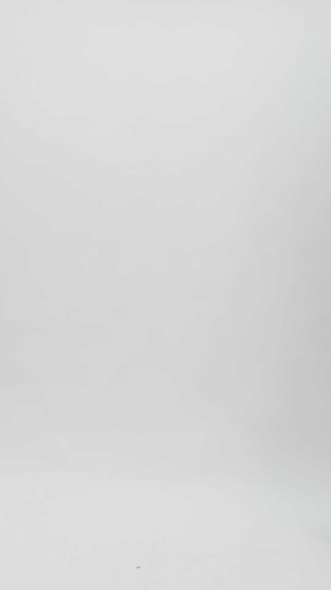 An evening wear set featuring a draped loose top with draped florals on the shoulder paired with a long slim-cut skirt.