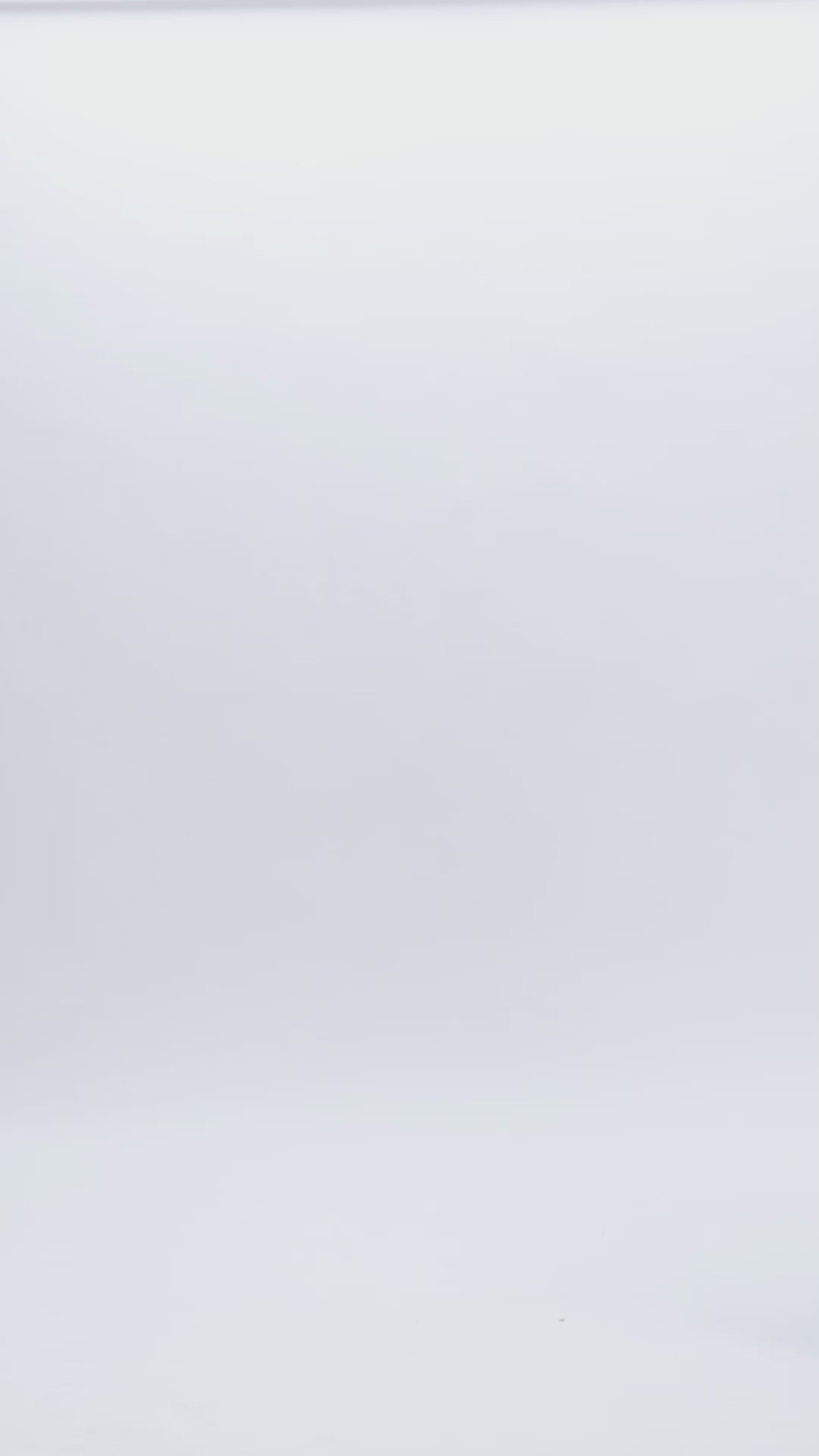 A royal blue wide legs jumpsuit, with a heart shaped like corset top, over it a full beaded tulle fabric with short sleeves, and a V-shaped open back. This tulle is see-through and has beadings and chains all over it.