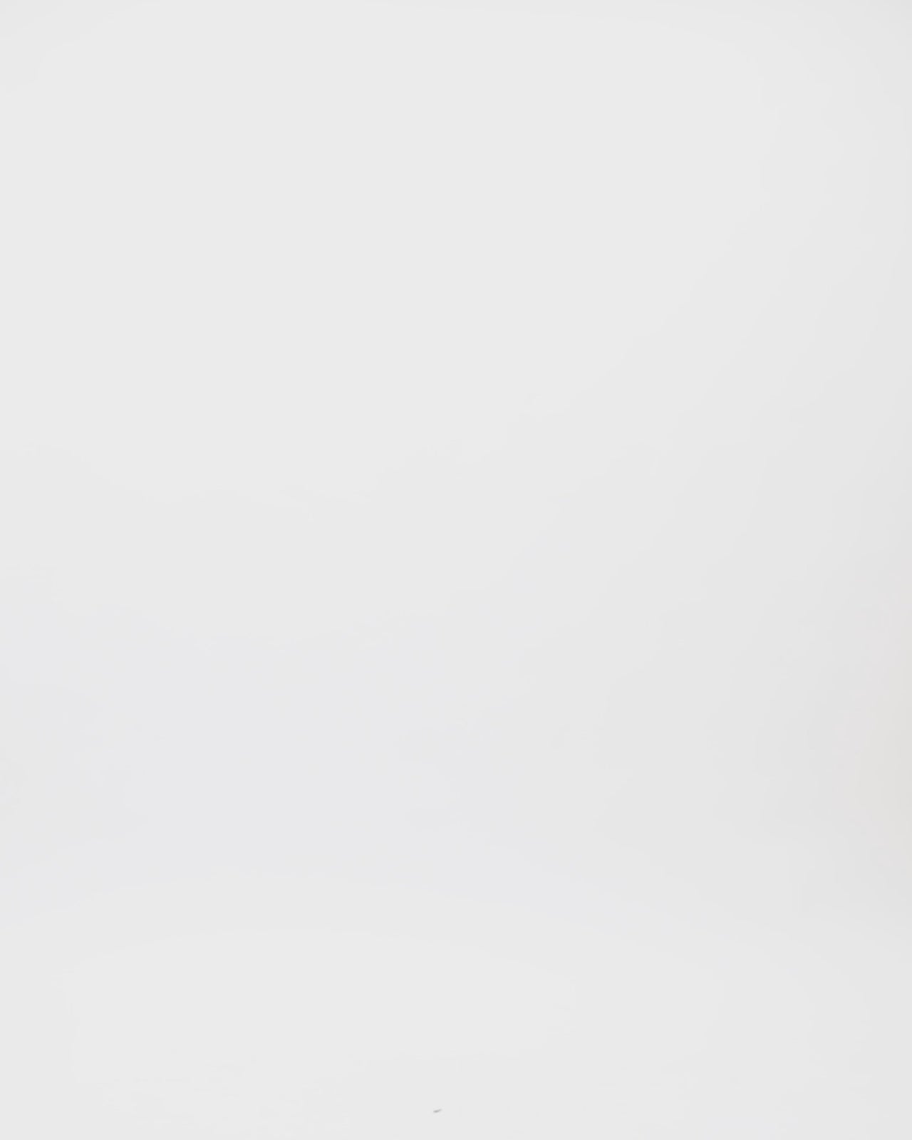 A caramel color kaftan-style evening dress with a beaded neckline.