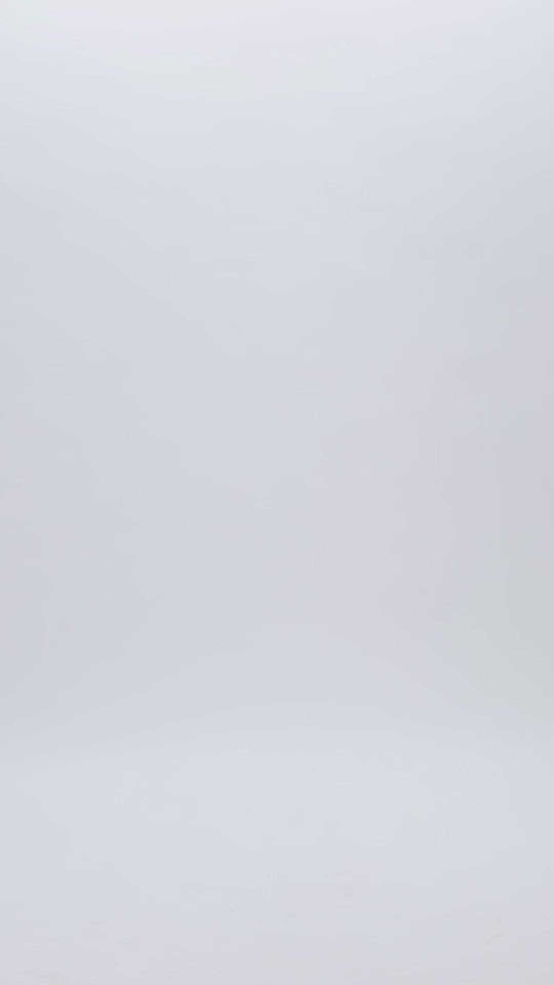 An evening wear set in lime color featuring a midi straight cut skirt, that has a slit in the front and beadings on the side hips. The top has a sharp bow design on the waist line.