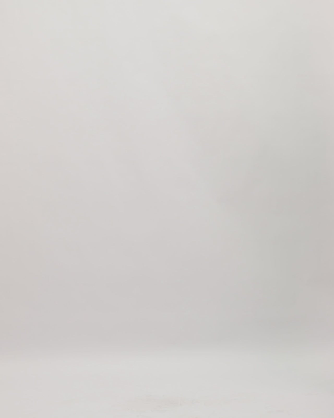 A slim-cut beaded evening dress with draped crepe cape-like sleeves and a slit at the back.