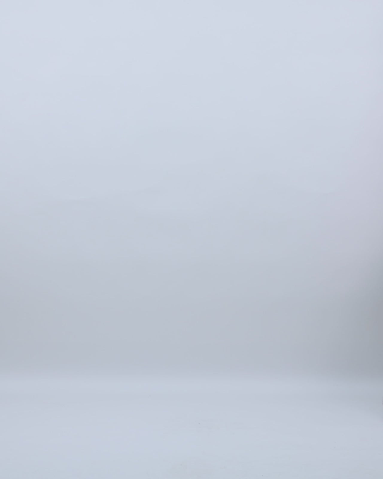 A beaded strapless evening dress with a dropped-down waistline and a draped skirt.