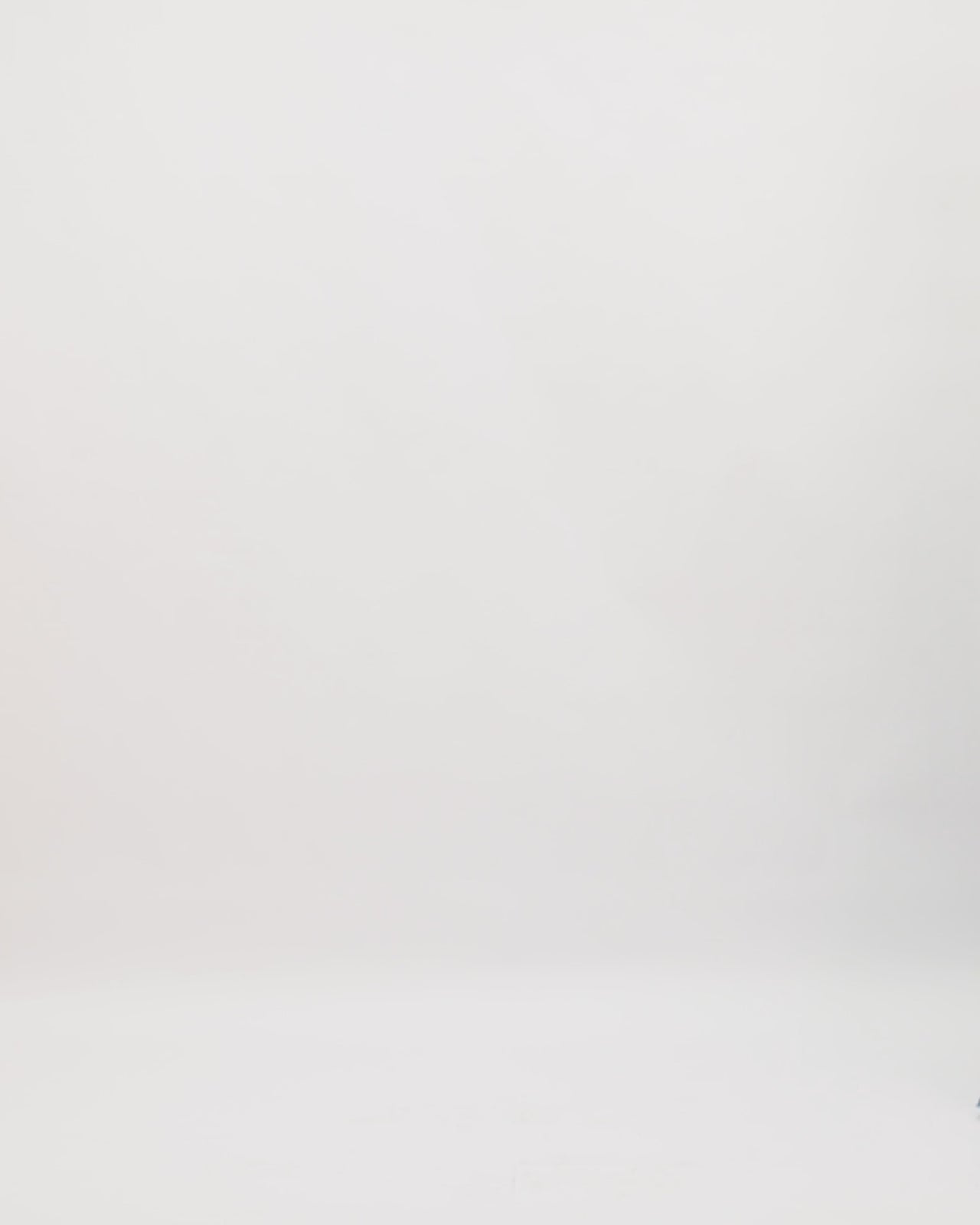 An off-the-shoulders lace evening dress in blue color with a beaded neckline and floor-length sleeves.