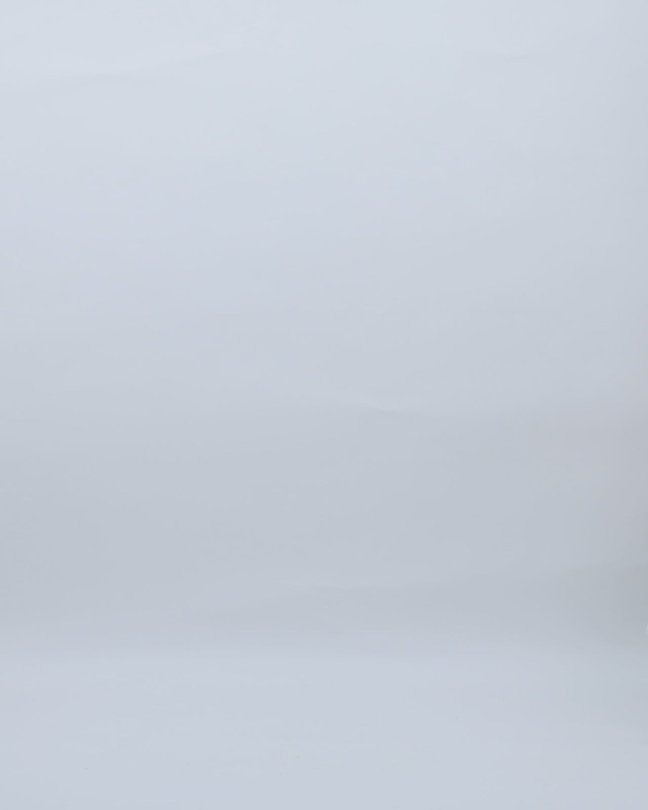 A short-sleeves white midi dress in embroidered lace with a see-through back.