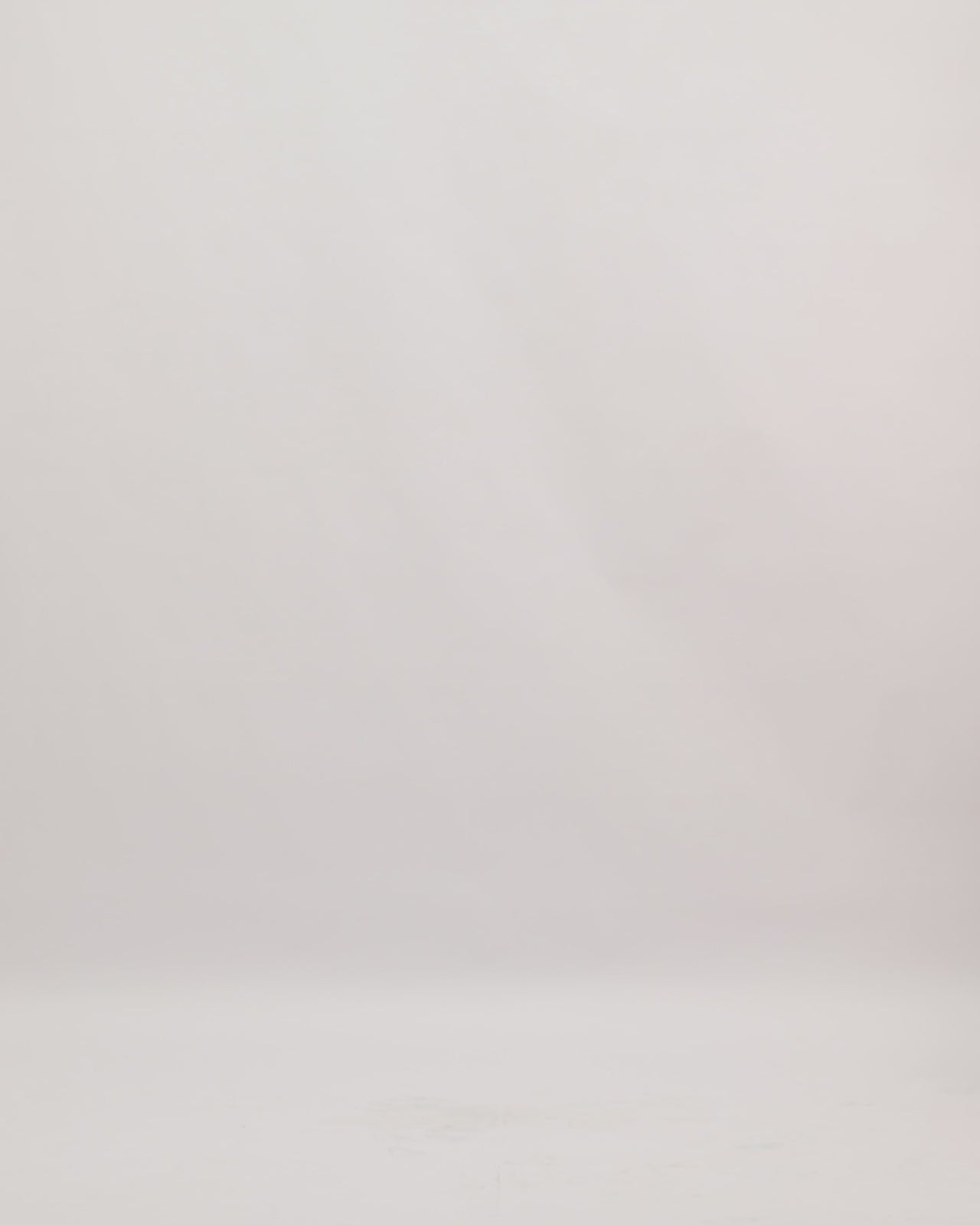 An off-the-shoulders pink midi dress featuring ruffles on the neckline and hemline and a detachable belt. 