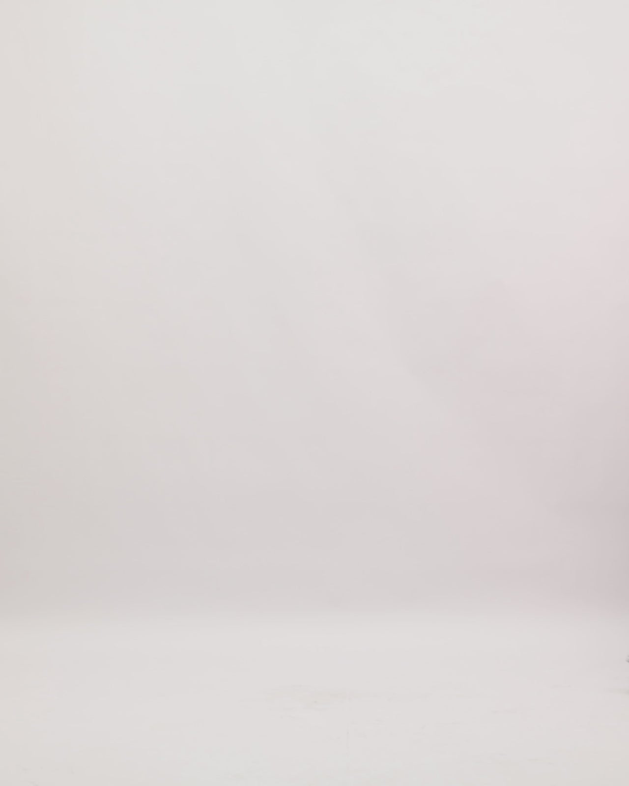 An asymmetrical neckline evening dress in mulberry color with an embroidered floral organza cape.