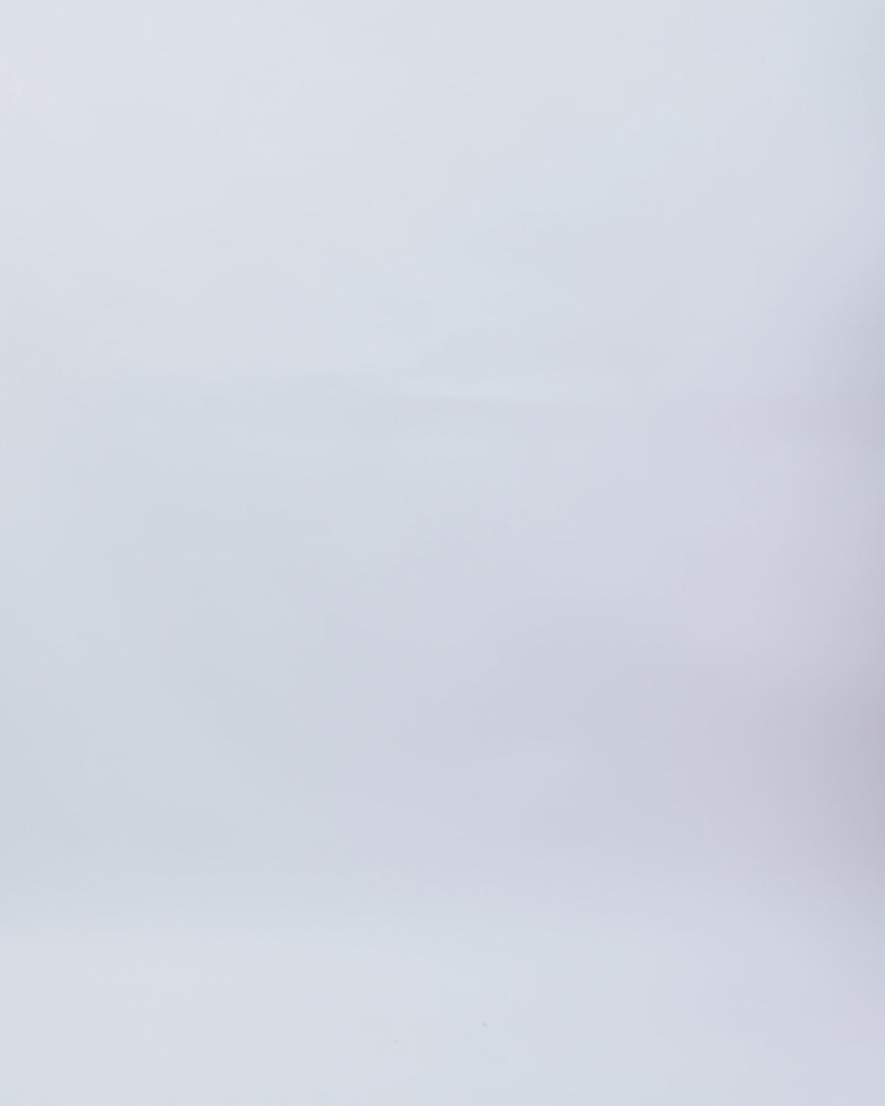 A one-shoulder fuchsia evening dress featuring a draped corset and beaded heart shaped neckline.