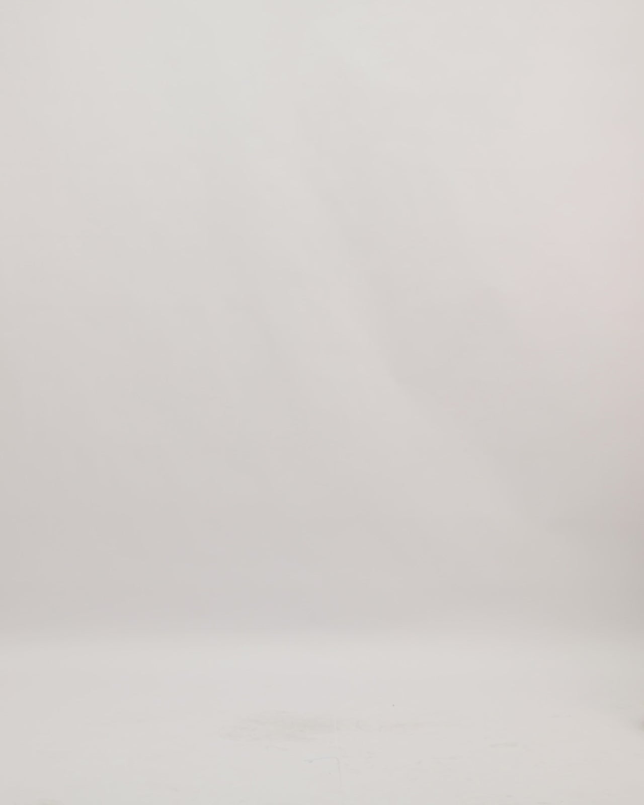 A mermaid-cut strapless evening dress in champagne color with 3D flower details.